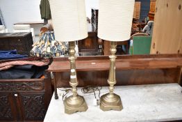 A pair of brass table lamps