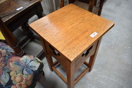 A small craftsman made honey oak occasional table or plant stand, of square section with pierced