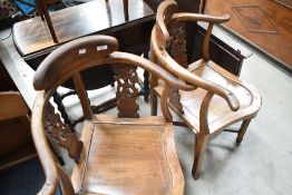 A pair of Oriental style hardwood corner chairs