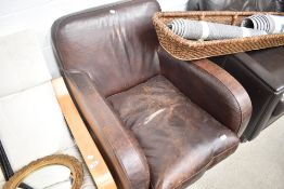 A distressed leather easy chair
