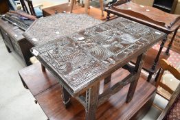 A tribal art style carved table, width approx. 56cm