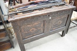 A period oak kist , having carved panels to front on stile feet, nice size, width approx. 99cm