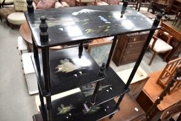 A modern oriental black painted open bookcase of display, of small proportions painted with Japanese
