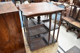 An early 20th Century stained frame table top revolving bookcase