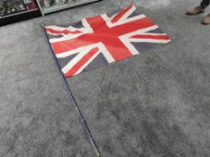 A large vintage Union Jack Flag with pole, size 95cm x 135cm