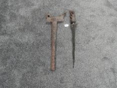 A Indonesian Kris with highly decorated carved wood handle, wood scabbard highly decorated and