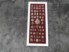 A framed display of Military Cap Badges plus one Helmet Plate including Cornwall, Brecknockshire,