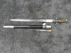 A 19th Century German Hunting Sword with horn handle, decorated single edge blade with spear