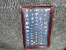 A framed and glazed collection of Border Regiment Sweetheart Brooches, mainly all different designs,