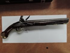 A Sea Service Flintlock Pistol with brass butt, cap no N31, brass trigger guard, tower mark, crown