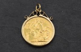A gold sovereign dated 1910 in a removable 9ct gold pendant mount, approx 9.8g
