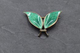 A Norwegian silver leaf brooch having green enamel decoration, bearing marks for David Anderson