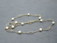 A 9ct gold pearl and fancy link chain, approx 24' & 10.9g