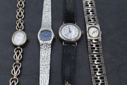 Three HM silver wrist watches, two having attached silver decorative straps, a black leather strap