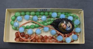 Four strings of beads including painted glass, orange striped agate, coral and turquoise facetted