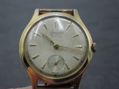 A gent's Junghans automatic gold plated wrist watch having baton numeral dial with subsidiary