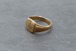 A gent's 9ct rose gold signet ring bearing monogram and moulded shoulders, size W/X & approx 6.8g