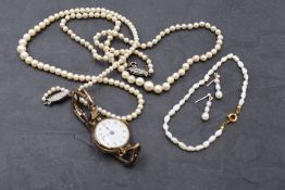 A selection of jewellery including two strings of cultured pearls with white metal clasps stamped