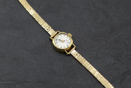 A lady's 9ct gold wrist watch by Zenith no: 381D052 having Arabic numeral dial to circular face in
