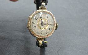 A vintage 9ct gold wrist watch having Arabic numeral dial, (missing digit 12) in engraved case on