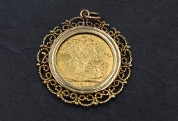 A gold sovereign 1918 Sydney mint, in a 9ct gold decorative removable pendant mount, approx 12.1g
