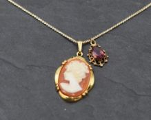 A 9ct gold pendant having pink stone in decorative mount on 9ct snake link chain, and a cameo