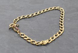 A yellow metal curb link bracelet with additional plated link (AF) approx 8g