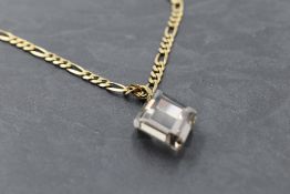A 9ct gold figaro link chain with magnetic clasp, approx 18' & 10.2g with a smoky cut glass pendant