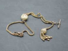 A yellow metal double chain fine link watch chain bearing plaque stamped 9C with central birds