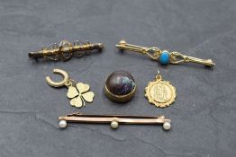 A small selection of 9ct gold and yellow metal including three bar brooches, St Christopher pendant,