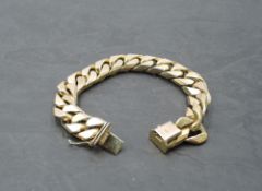 A lady's heavy flat curb link bracelet with concealed box clasp, approx 180mm long and 71.3g