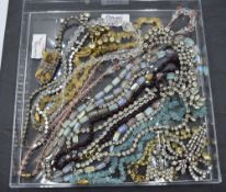 A selection of mainly vintage costume jewellery including strings of crystal beads, diamante