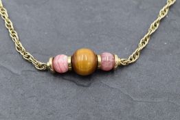 A 9ct gold rope chain necklace with central three bead panel, approx 15' & 13.4g