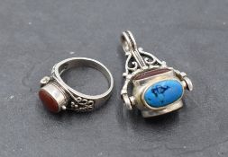 An HM silver spin fob having four oval non precious stone panels, and a silver Artisan style dress