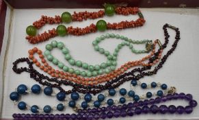 Six vintage strings of beads including branch coral, coral bead, jadeite, lapis lazuli etc