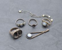 A small selection of white metal jewellery including an Artisan style ring with study of maiden,