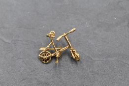 A 9ct gold articulated bicycle charm, approx 2.8g