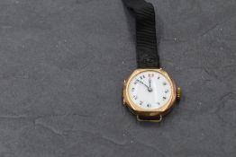 A lady's vintage 9ct rose gold wrist watch having an Arabic numeral dial with gilt dot perimeter