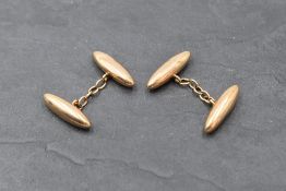 A pair of 15ct rose gold cufflinks of plain lozenge form with chain connectors, approx 4.3g