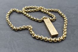 A 9ct gold ingot pendant having over sized hallmarks and brushed finish on a heavy belcher link