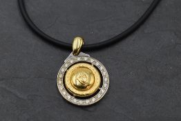A white and yellow metal Versace Medusa style pendant necklace stamped 750 having the central Medusa