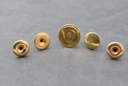 Three yellow metal collar studs having seed pearl decoration, stamped PATENT18, a similar plain stud