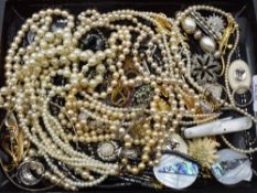 A selection of costume jewellery including strings of hematite and simulated pearls, brooches,