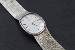 A gent's dress watch by Enicar no:69-419, having baton numeral dial to silvered oval face on brick