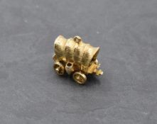 A 9ct gold charm in the form of an American station wagon, approx 9.7g