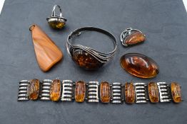 A selection of Baltic amber jewellery including white metal and amber hinged bangle stamped 925,