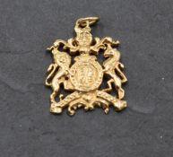 A 9ct gold charm in the form of the Royal Coat of Arms, approx 4.4g