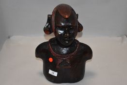 A 20th century ethnic hard wood hand carved bust of an African warrior