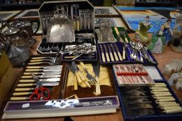A large collection of table ware cutlery and flatware including toast rack and cased canteen