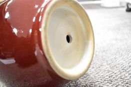 A Chinese porcelain bottle vase having graded flambe glaze with cream underglaze